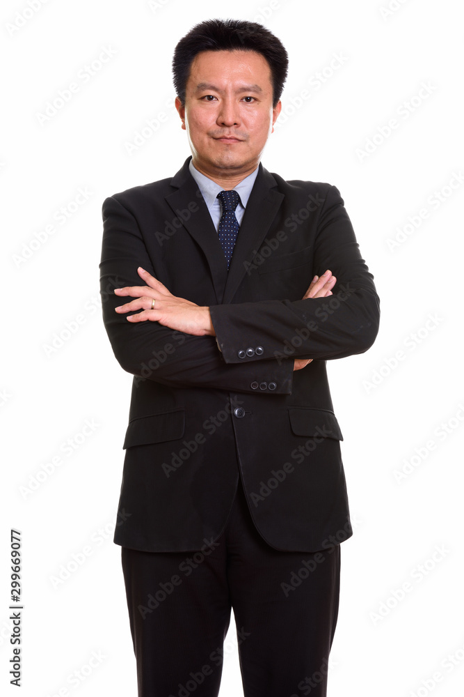 Studio shot of Japanese man isolated against white background Studio shot of Japanese man isolated against white background