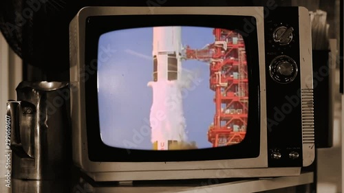 Historic launch of Apollo 11 on an Old Retro Sepia Television.  Elements of this video furnished by NASA.  photo