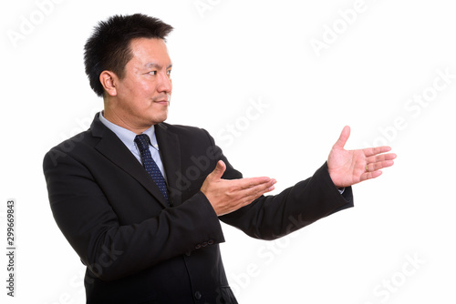 Studio shot of Japanese man isolated against white background