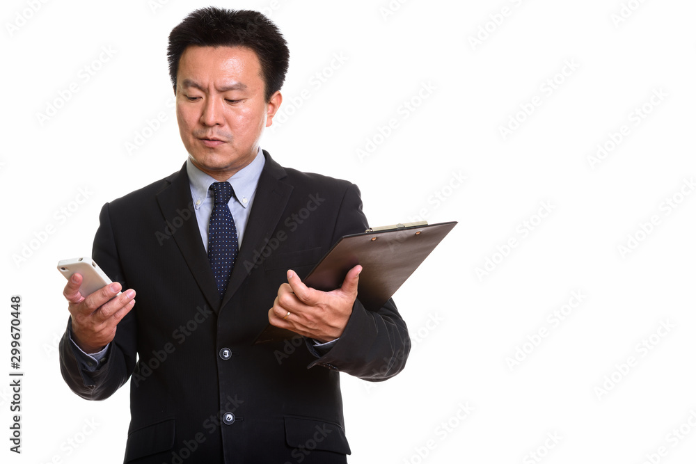 Studio shot of Japanese man isolated against white background Studio shot of Japanese man isolated against white background