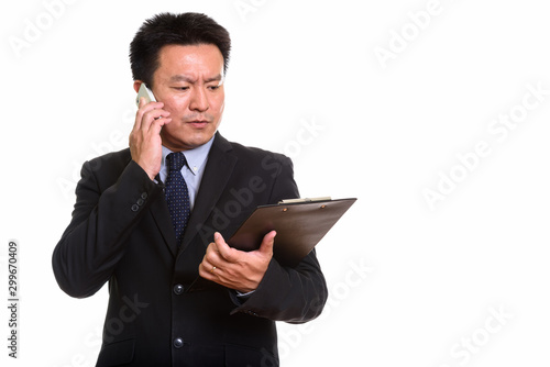 Studio shot of Japanese man isolated against white background