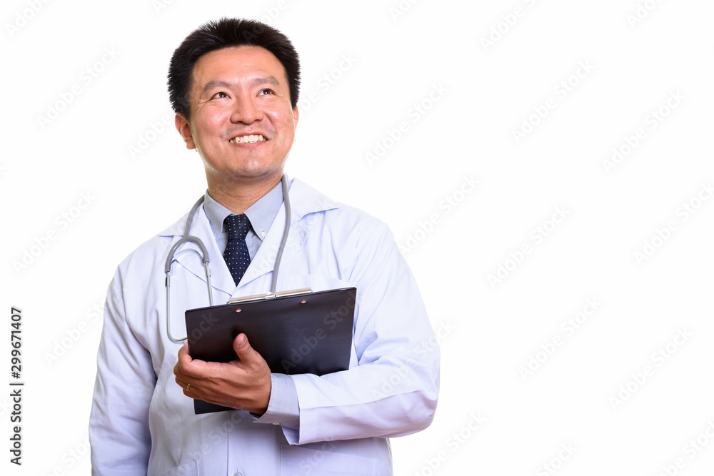 Studio shot of Japanese man isolated against white background Studio shot of Japanese man isolated against white background