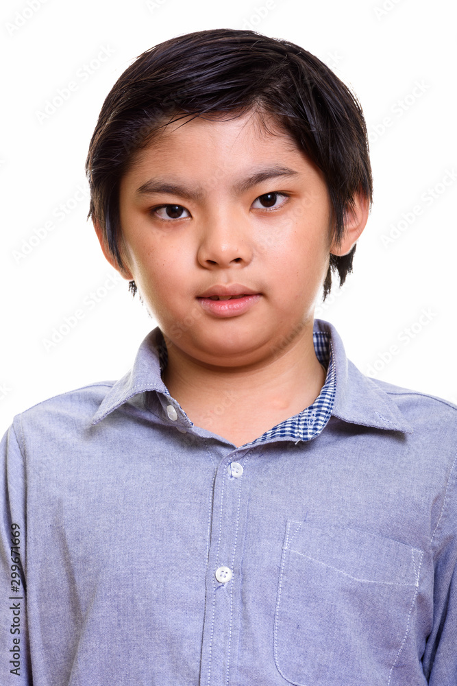 Studio shot of Japanese boy isolated against white background Studio shot of Japanese boy isolated against white background