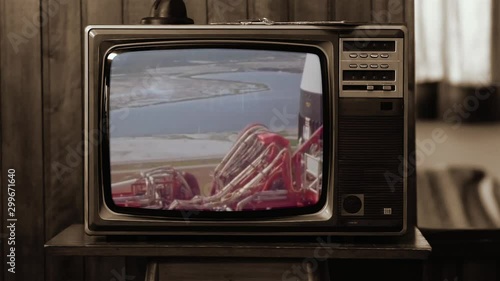 1969. Historical Footage of the NASA Apollo 11 Launch on an Old Retro TV. Sepia Tone. Elements of this video furnished by NASA. Public Domain Footage anf Free for Use.