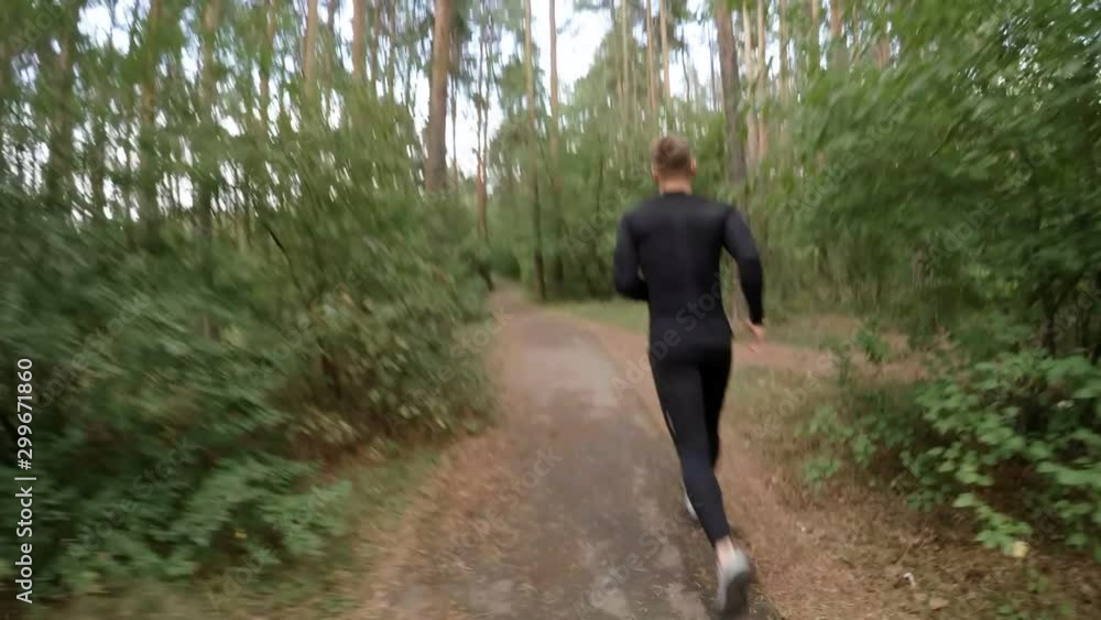 POV shot of woman holding hands with athletic boyfriend, following him in forest and then start running together while having outdoor partner workout on summer day POV shot of woman holding hands with athletic boyfriend, following him in forest and then start running together while having outdoor partner workout on summer day