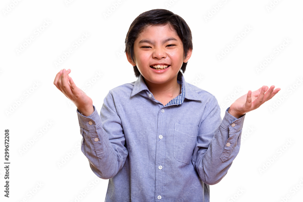 Studio shot of Japanese boy isolated against white background Studio shot of Japanese boy isolated against white background