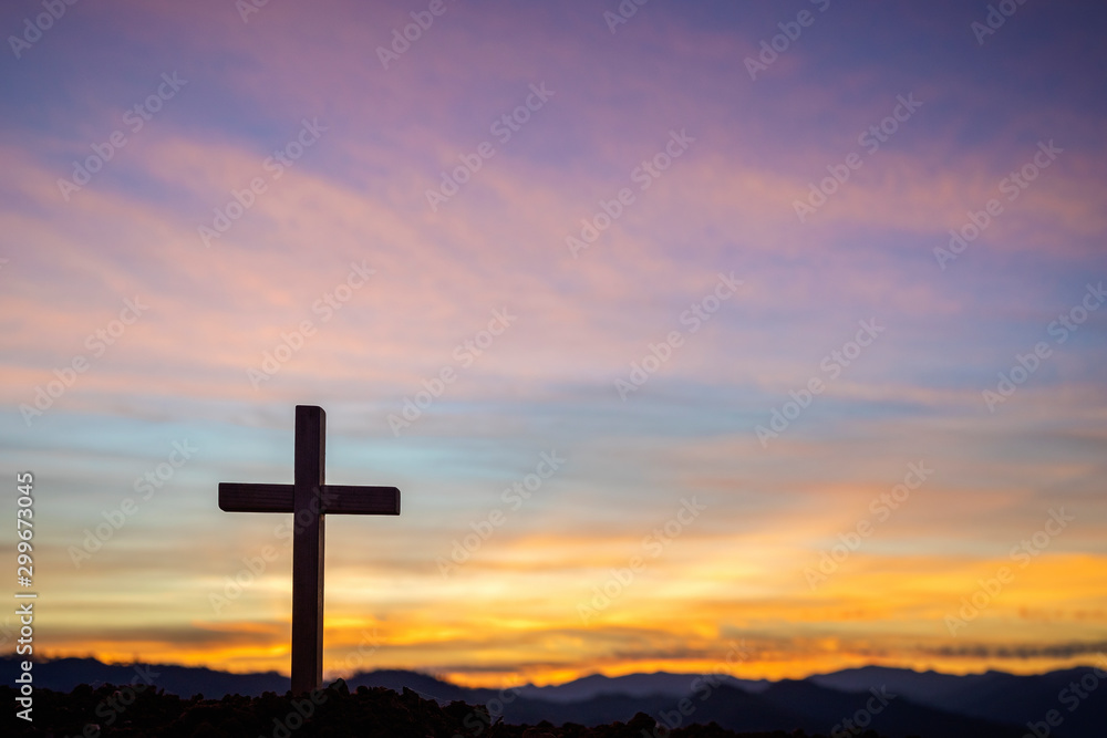 Silhouette cross on mountain at sunset background.Crucifixion Of Jesus Christ