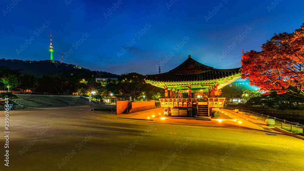 Nightscape of pavilion at Namsangol hanok traditional village and viewpoint of Namsan Seoul Tower in Seoul,South Korea Nightscape of pavilion at Namsangol hanok traditional village and viewpoint of Namsan Seoul Tower in Seoul,South Korea