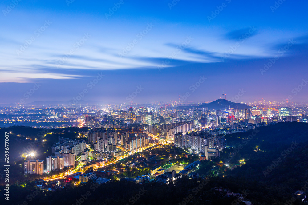 Sunrise of Seoul Downtown cityscape . Aerial view of Nansan Seoul Tower and lotte tower. Viewpoint from Ansan mountain best landmark of Seoul , South Korea Sunrise of Seoul Downtown cityscape . Aerial view of Nansan Seoul Tower and lotte tower. Viewpoint from Ansan mountain best landmark of Seoul , South Korea