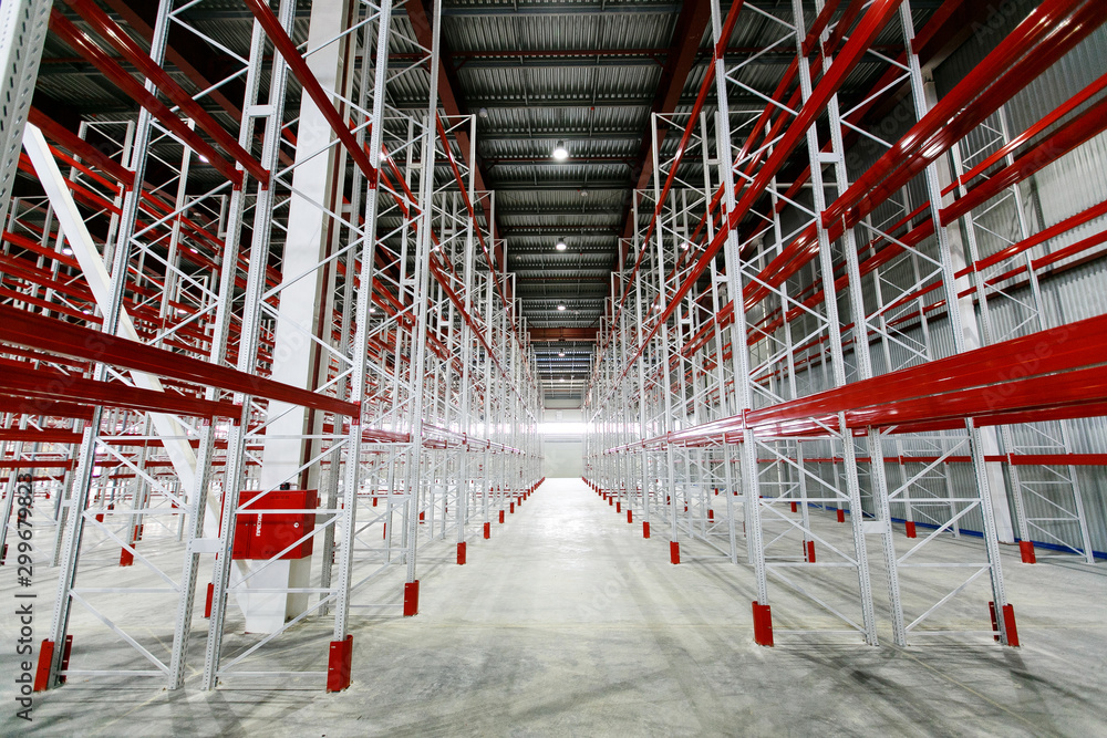 Fototapeta premium Empty storage facilities in the logistics center. Empty shelving in a warehouse.