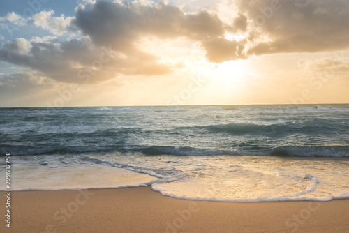 Sunrise over the ocean on the beach © Mitch