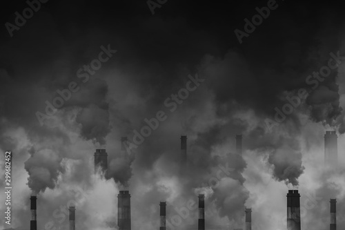 Air pollution smoke from factory chimneys dark scary sky with space for text