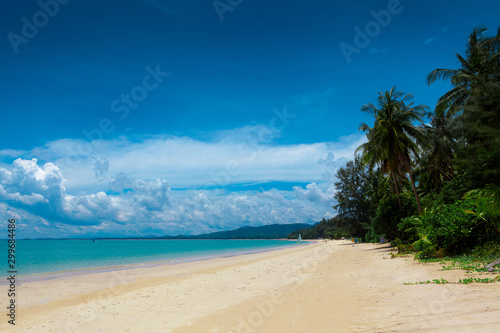 Pristine white sandy beach with aqua blue sea in Khao Lak close to Phuket Island on the Andaman coast, Phang Nga Province, Thailand.