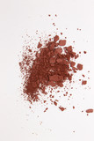 This is a photograph of a Burnt Umber Powder Eyeshadow isolated on a White Background