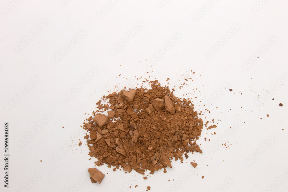 This is a photograph of a Brown Powder Eyeshadow isolated on a White Background This is a photograph of a Brown Powder Eyeshadow isolated on a White Background