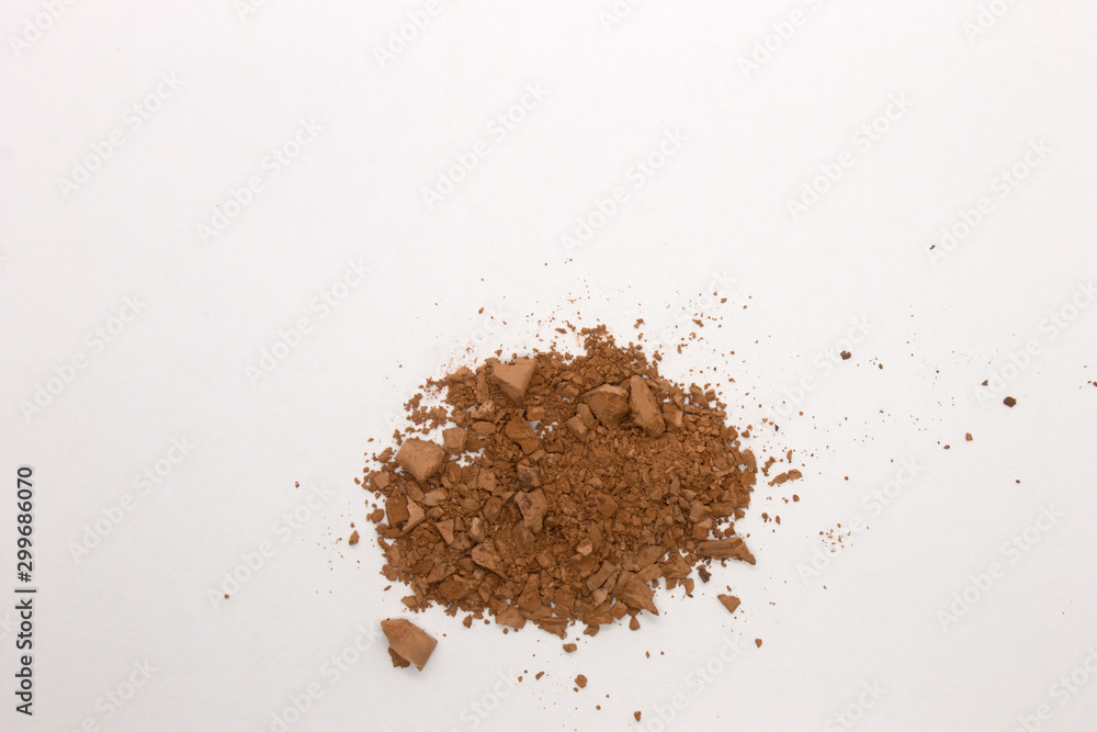 This is a photograph of a Brown Powder Eyeshadow isolated on a White Background This is a photograph of a Brown Powder Eyeshadow isolated on a White Background
