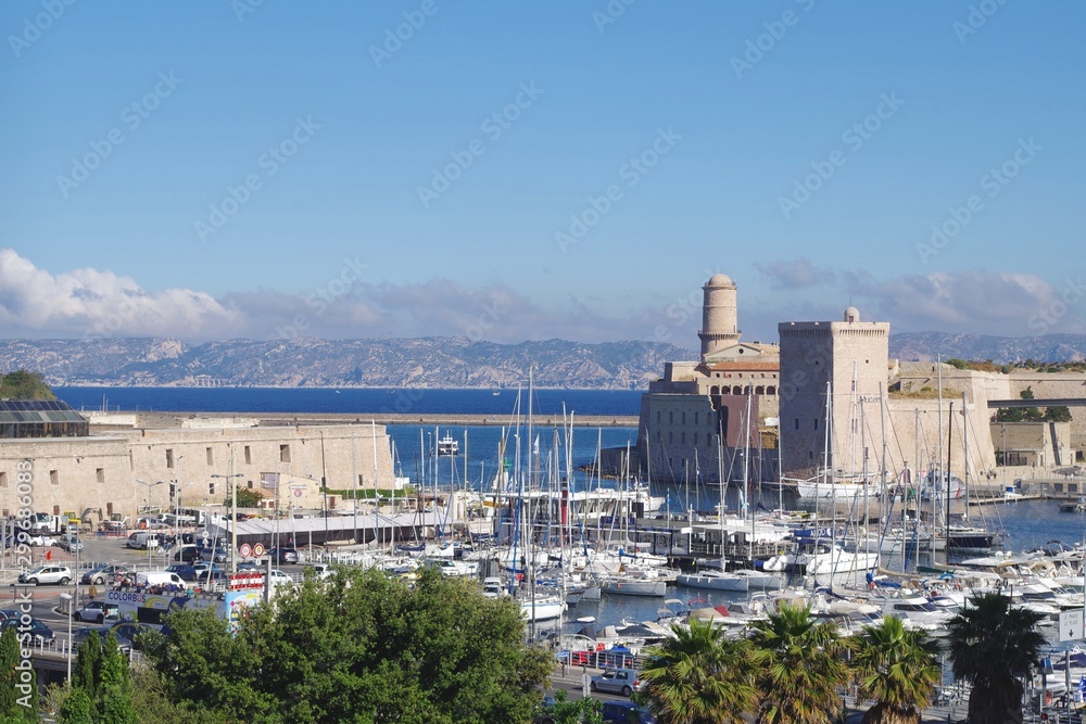Picture of the entrance of the Vieux Port in Marseille, South of France. A very famous place full of history with Saint Jean castle in background.