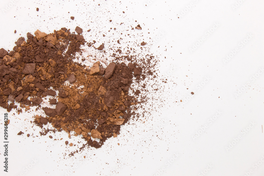This is a photograph of Brown Powder Eyeshadow isolated on a White Background