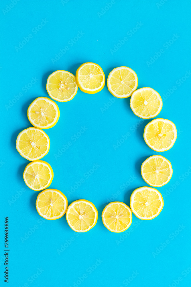 Lemon circle mockup on blue background top view copy space Lemon circle mockup on blue background top view copy space