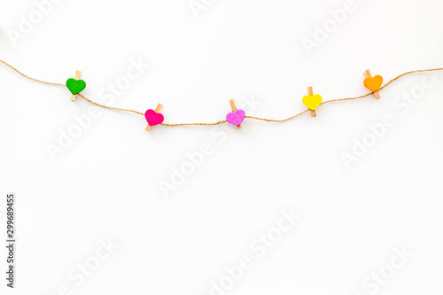 Garland with heart icons on white background top view copy space