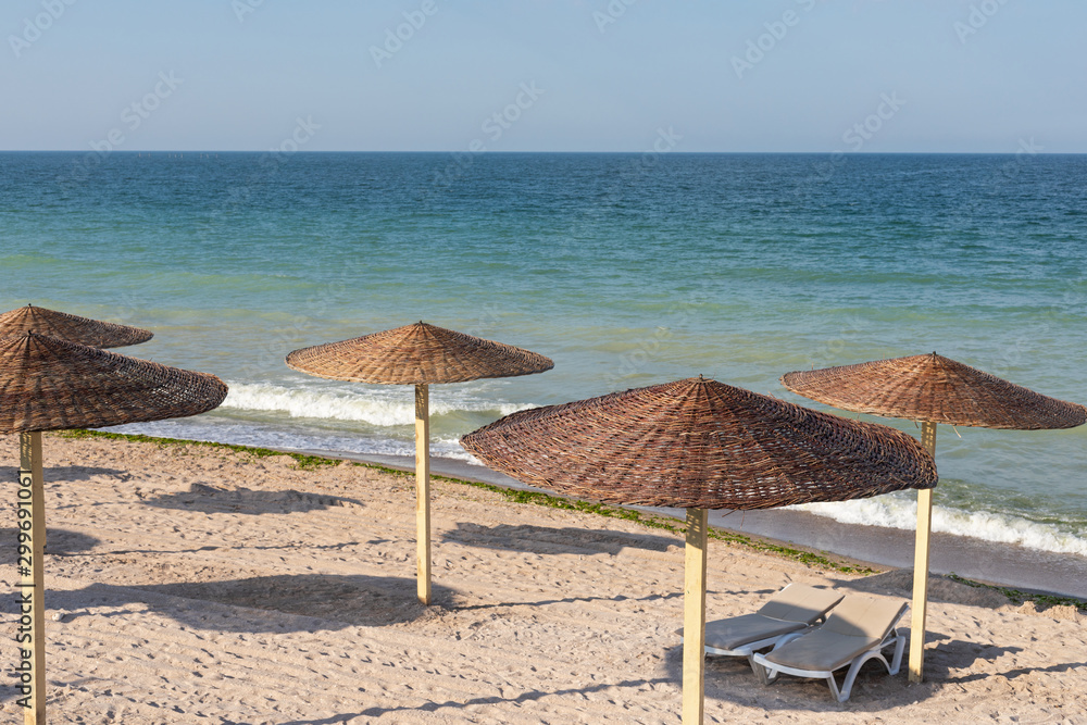 Colorful sunbeds and umbrellas at the beach Colorful sunbeds and umbrellas at the beach
