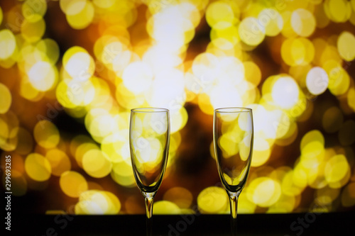 Two glasses of champagne on a bokeh background. Close-up isolated background.