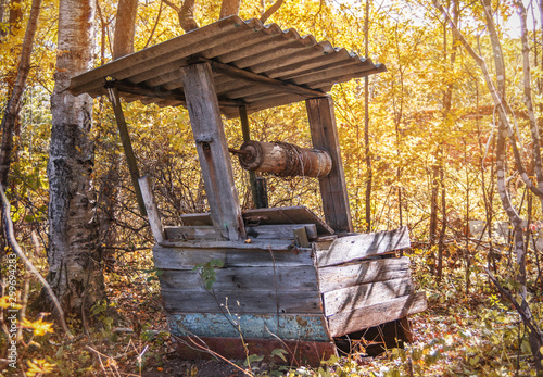 Abandoned water well skewed and unused for a long time in the forest