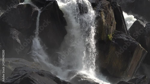 Scenic waterfall Uchar cascade view with currents and boulders. Altai mountains, Siberia, Russia. photo