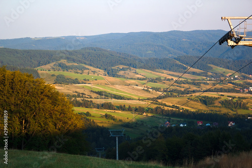 Beskid Sadecki and Village Szczawnik in summer.  View from Ski Resort Dwie Doliny Muszyna - Wierchomla, Poland. photo