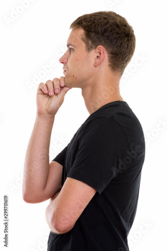 Studio shot of young man isolated against white background