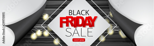 Black Friday Sale banner or long narrow header for website. Design concept for big discount of the year with wooden wall and glowing lights garland