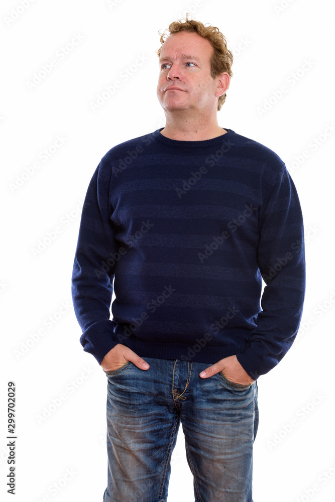 Studio shot of mature man with curly blond hair isolated against white background Studio shot of mature man with curly blond hair isolated against white background