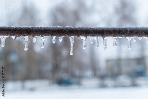 icicles on a metal crossbar