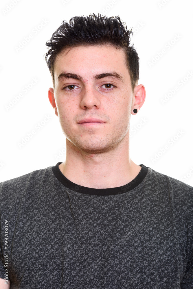 Fototapeta premium Studio shot of young handsome man isolated against white background