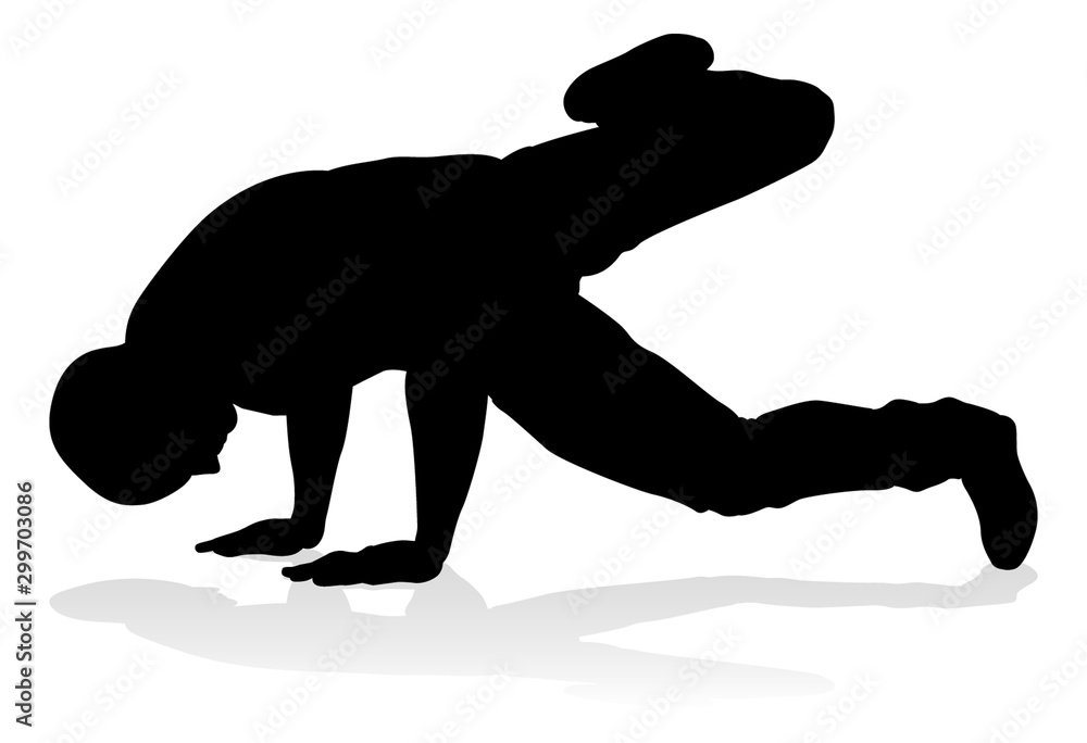 Obraz premium A male street dance hip hop dancer in silhouette