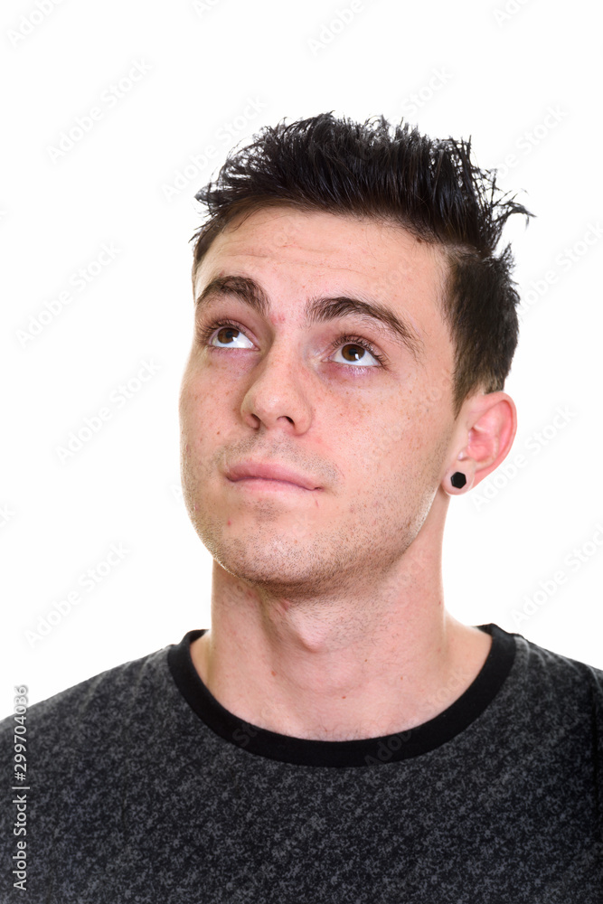 Studio shot of young handsome man isolated against white background Studio shot of young handsome man isolated against white background