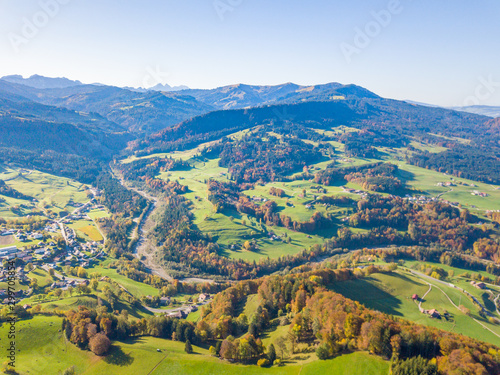 Fototapeta Naklejka Na Ścianę i Meble -  Aerial view of Swiss countryside. Pre-alpine landscape in Switzerland. Peaceful farmland in rural area.