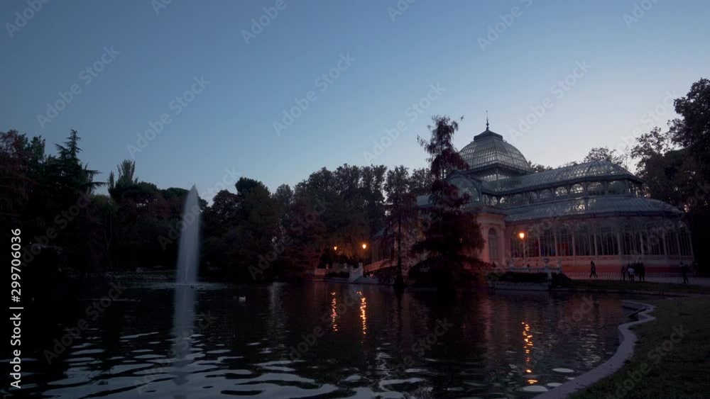 Blue hour view of Crystal Palace or Palacio de cristal in Retiro Park in Madrid, Spain. The Buen Retiro Park is one of the largest parks of the city of Madrid, Spain Blue hour view of Crystal Palace or Palacio de cristal in Retiro Park in Madrid, Spain. The Buen Retiro Park is one of the largest parks of the city of Madrid, Spain