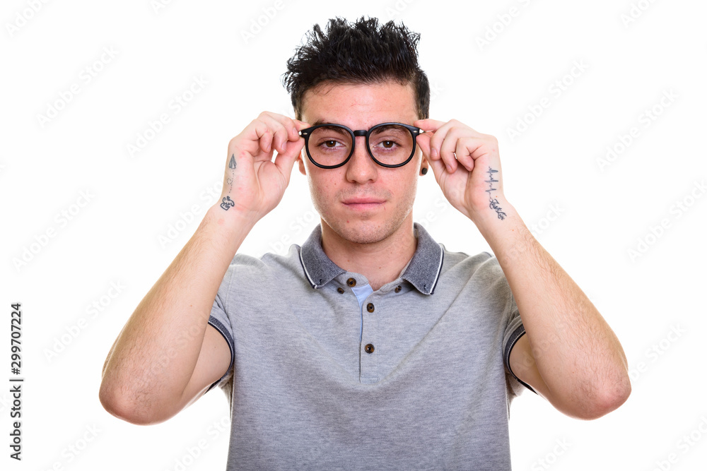 Studio shot of young handsome man isolated against white background Studio shot of young handsome man isolated against white background