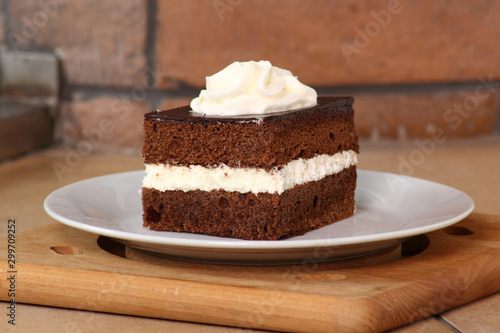 Chocolate Sponge Cake filled with whipped cream. Cream Pie.