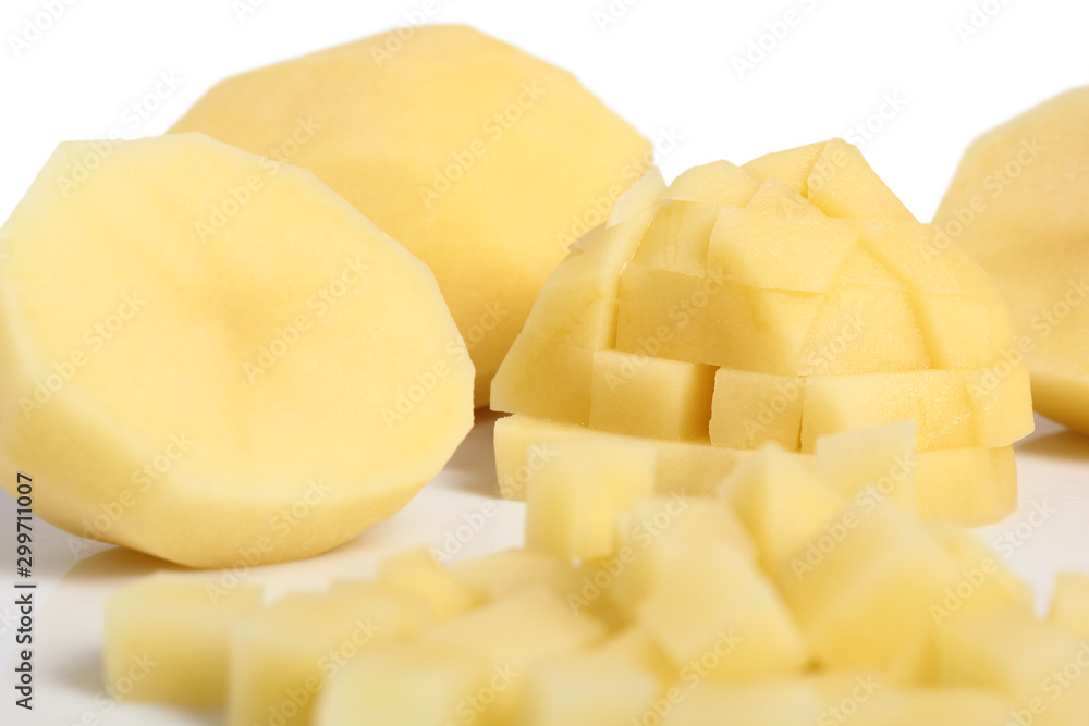 Raw diced peeled potatoes. Isolated with a white background. Raw diced peeled potatoes. Isolated with a white background.