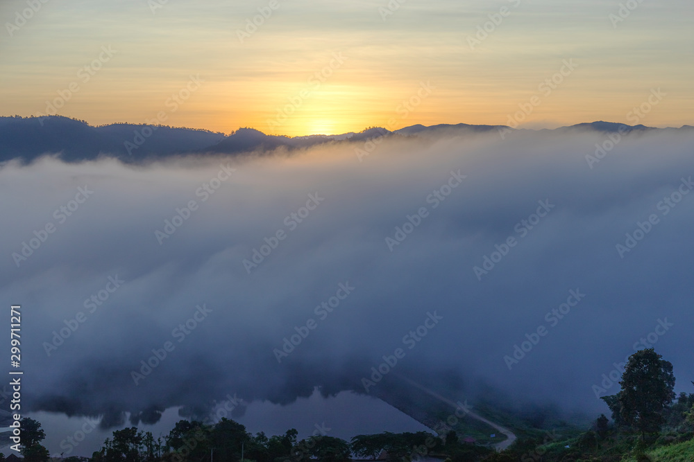 beautiful colorful sunrise sky with mist for background