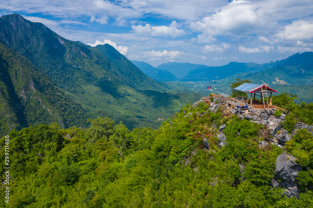 Fototapeta premium Aerial view of mountains in Nong Khiaw. North Laos. Southeast Asia. Photo made by drone from above. Bird eye view.