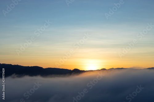 beautiful colorful sunrise sky with mist for background