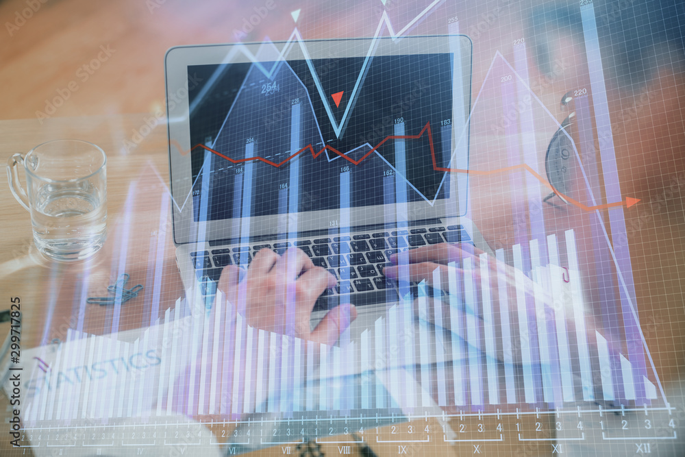Multi exposure of market chart with man working on computer on background. Concept of financial analysis. Multi exposure of market chart with man working on computer on background. Concept of financial analysis.