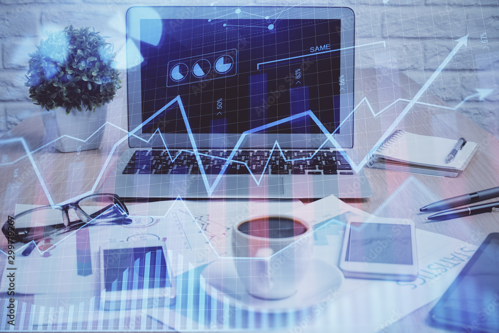 Forex market graph hologram and personal computer on background. Double exposure. Concept of investment. Forex market graph hologram and personal computer on background. Double exposure. Concept of investment.