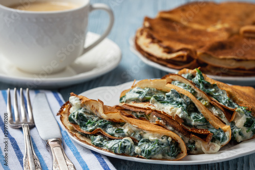Spinach and feta cheese filled crepes. 