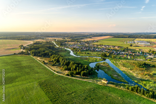 Fotografia Aerial view. Small european village. Blue winding river.