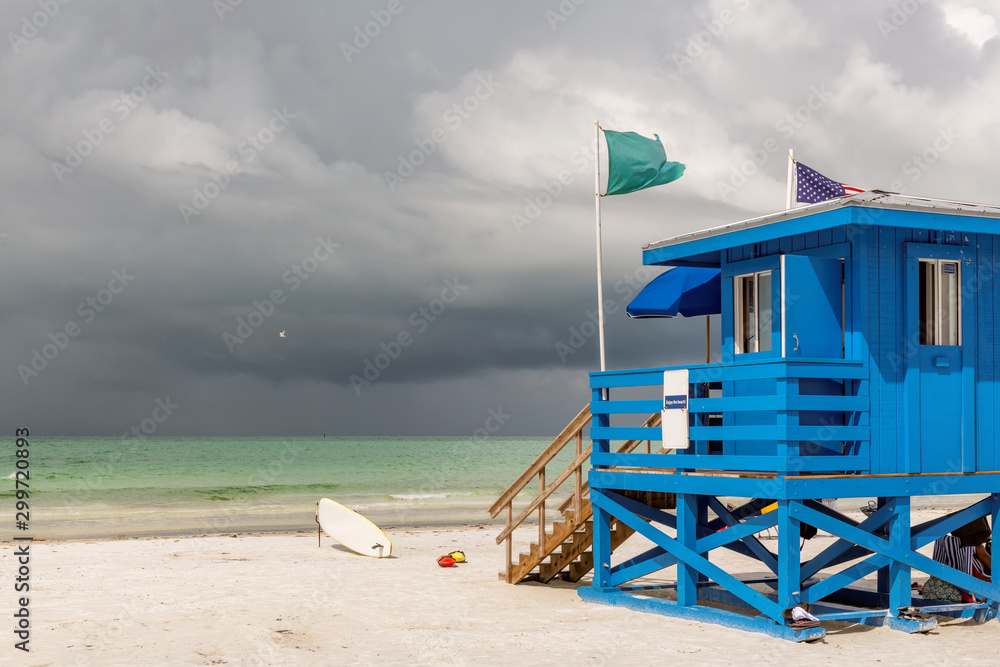Siesta Key beach and blue wooden lifeguard hut on Florida Gulf Coast