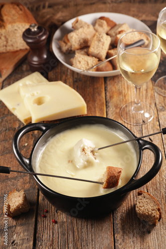cheese fondue with baguette and white wine